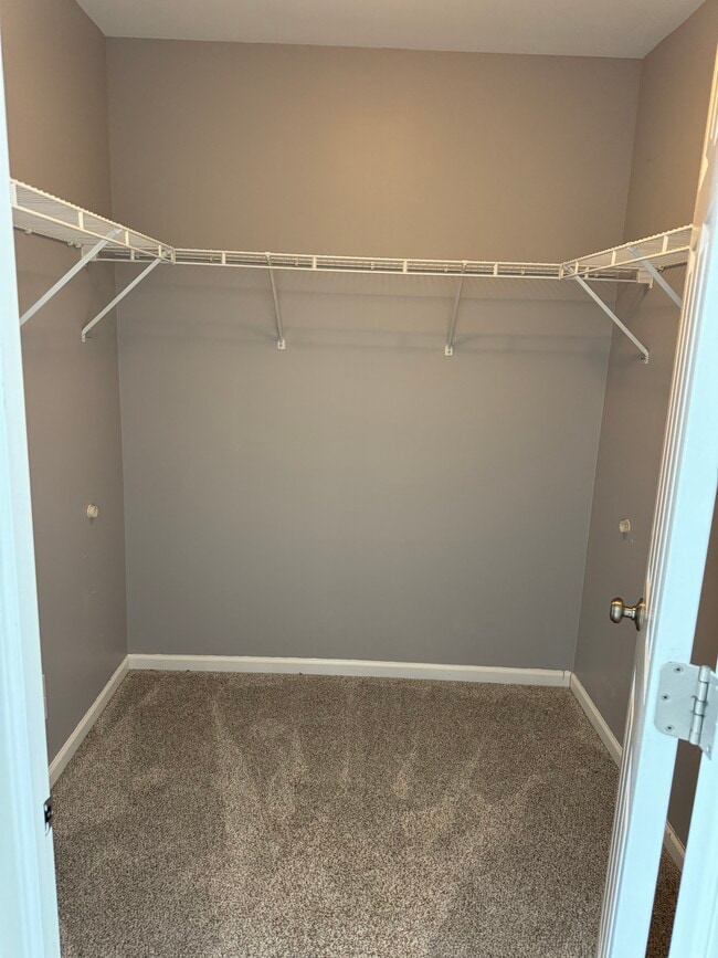 walk in closet for primary bedroom - 2416 Georgetown Cir