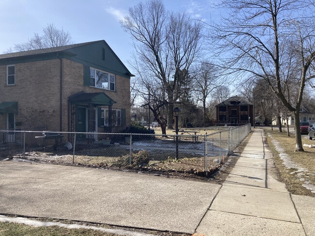 Driveway, house, and yard. - 1312 Brooklyn Ave