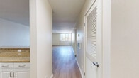Located at 13999 Marquesas Way in the desirable Marina del Rey community, this one-bedroom, one-bathroom residence offers a well-designed, single-level layout bathed in natural light. Light-toned hardwood-style flooring flows consistently throughout the space, creating a clean and cohesive aesthetic.

The open-concept living area is bright and airy, featuring large floor-to-ceiling windows and a sliding glass door that leads directly to a private balcony, offering views of the surrounding neighborhood. The kitchen is defined by a peninsula with granite countertops, white shaker-style cabinetry, recessed lighting, and stainless steel appliances including a refrigerator, range, and microwave — combining both style and functionality.

The generously sized primary bedroom features its own sliding glass door access to a balcony, providing additional natural light and outdoor connectivity. The full bathroom is finished with a granite-topped vanity, white cabinetry, a glass-enclosed shower/tub combo, and matching light wood flooring, maintaining the home's consistent and polished design language.

Throughout the residence, neutral white walls and clean architectural lines contribute to a bright, modern atmosphere well-suited for everyday living in the heart of Marina del Rey.