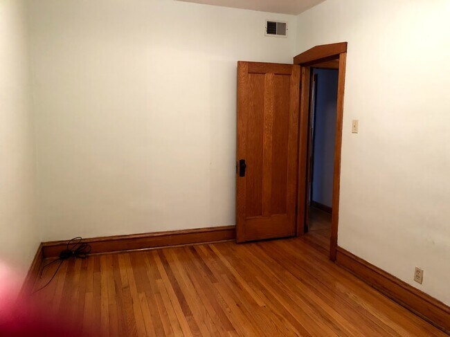 Bedroom - Hardwood floors - 4056 N Menard Ave