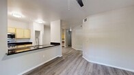 Located at 1975 Maxwell Ave in Woodland, CA, this single-floor 2-bedroom, 2-bathroom residence offers a well-designed layout with a clean, modern aesthetic. The open-concept living and dining area is finished with smooth luxury vinyl plank flooring, neutral-toned walls, and ceiling fans, creating a bright and airy atmosphere. A dedicated entrance leads seamlessly into the main living spaces.

The kitchen is thoughtfully equipped with light wood cabinetry, dark granite-style countertops, stainless steel appliances including a gas range, microwave, and refrigerator, and a breakfast bar that opens toward the dining area. Natural light filters in through a window overlooking lush greenery, adding a pleasant outdoor connection.

Both bedrooms feature plush carpeting, ceiling fans, and generous closet storage, including a walk-in closet with wire shelving systems. The primary bedroom offers comfortable proportions with a well-sized dedicated closet. The two bathrooms maintain consistent finishes, featuring wood-toned vanities with dark countertops and full tub-shower combinations.

A hallway with additional closet access connects the private quarters, while a balcony provides outdoor space. With three total closets throughout, the layout prioritizes practical storage alongside comfortable, functional living.