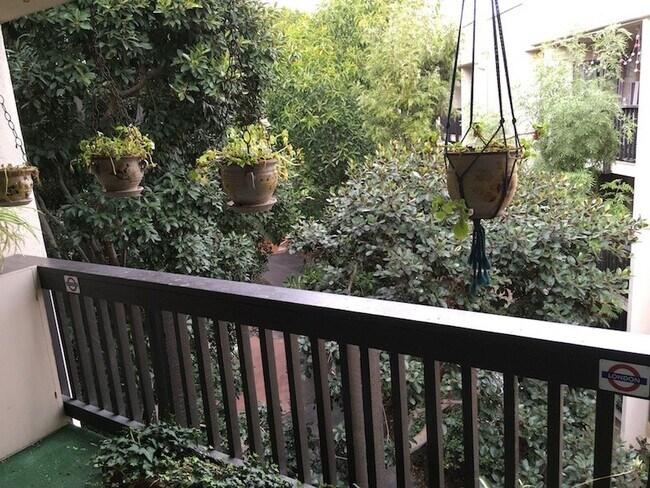 Balcony with lush tree view - 5316 Raintree Cir