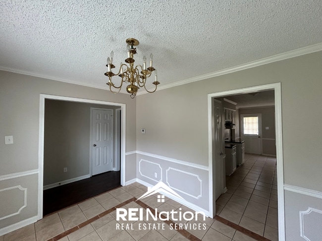 Photo - Spacious 4BR/2BA Near Southwind | High Ceilings, Brick Fireplace & 2-Car Garage House