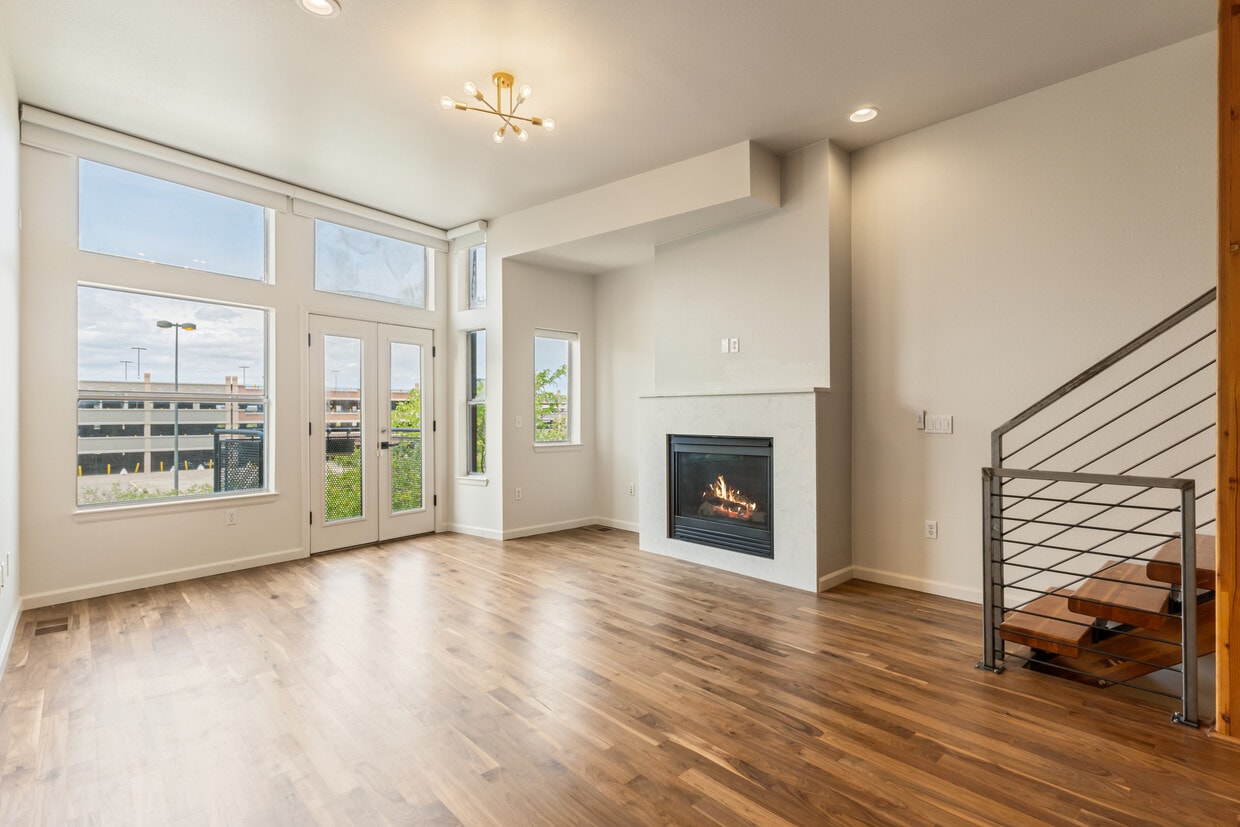 the living room features a gas fireplace & newly refinished floors - 2680 Blake St