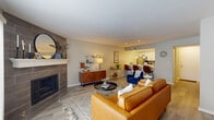 This 850 square foot apartment in Indianapolis presents a thoughtfully designed living space. The single-floor layout encompasses two bedrooms, two bathrooms, and an open-concept living area, creating an efficient use of space. The primary bedroom, measuring 140 square feet, offers ample room for comfort.

The kitchen showcases modern design with white cabinetry, contrasting dark appliances, and a sleek subway tile backsplash. The living room flows seamlessly from the kitchen, featuring contemporary furnishings and warm wood accents. Large windows allow natural light to illuminate the space, enhancing the airy feel.

Both bathrooms are equipped with essential fixtures and neutral color schemes, promoting a clean and fresh ambiance. The bedrooms are well-appointed, with one featuring a bold teal headboard for a pop of color.

Storage solutions are integrated throughout, including a walk-in closet with built-in shelving. The apartment's cohesive design is emphasized by consistent use of light wood-look flooring and a neutral color palette, creating a harmonious and inviting atmosphere throughout the 850 square feet of living space.