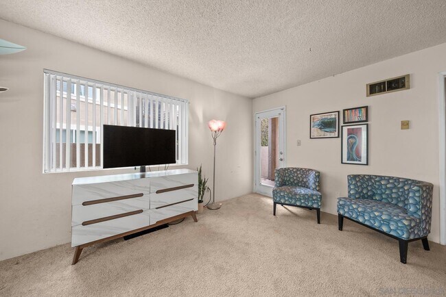 Building Photo - 7565 Charmant Dr