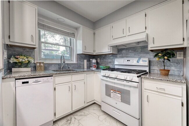 renovated kitchen with a new dishwasher and stove - 358 Esplanade