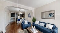 Located at 18200 Westfield Place Dr in Houston, TX, this thoughtfully designed one-bedroom, one-bathroom residence offers a comfortable and functional single-floor layout. Rich hardwood flooring and crown molding flow throughout, lending a polished, cohesive aesthetic to the entire space.

The living room is bright and welcoming, with large windows dressed in elegant draping curtains that invite generous natural light. A graceful arched passageway connects the living area to the combined dining room and kitchen, creating a seamless open-concept flow. The kitchen is well-equipped with dark cabinetry, stainless steel appliances including a refrigerator, range, and built-in microwave, and light-toned countertops that provide a striking contrast.

The spacious bedroom features crown molding, a ceiling fan, a natural light-filled window, and direct access to a walk-in closet. The full bathroom offers a well-lit vanity with a white countertop and large mirror. An in-unit laundry area with a full-size washer and dryer adds everyday convenience. A private balcony completes the layout, offering an outdoor retreat. The entryway, finished with stone tile flooring, provides a clean and welcoming transition into the home.
