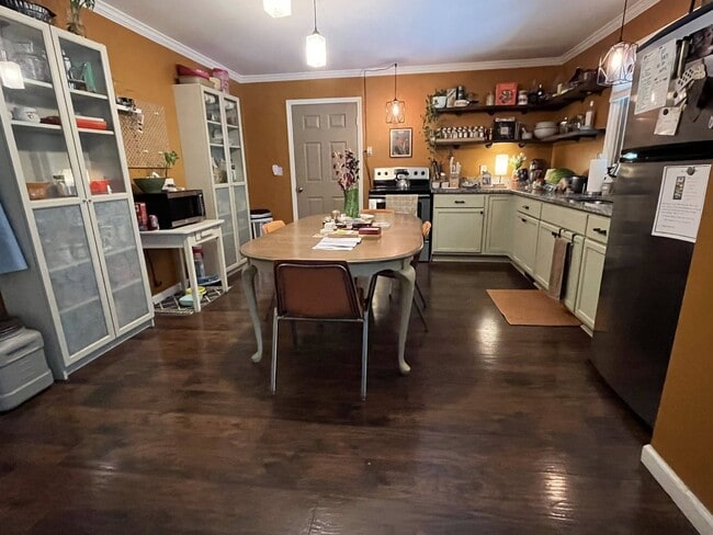 Kitchen open to living room. Exterior door to back covered porch - 3393 Mobile Rd