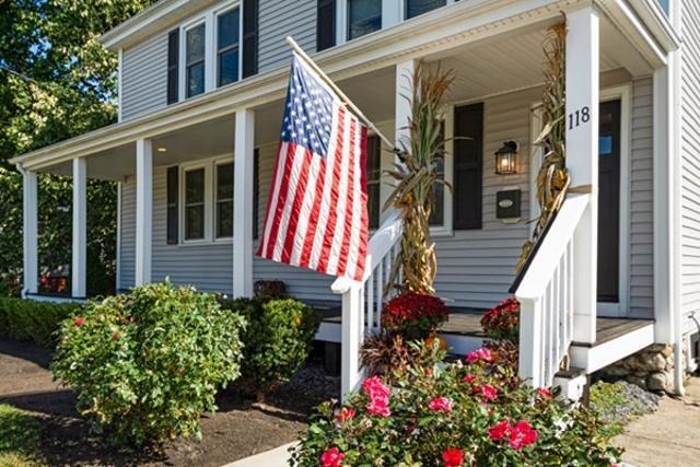 Front entrance and porch. Featuring a nicely landscaped lawn. - 118 Center Street