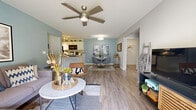 Located at 531 Tuscany Valley Ct in Crestview Hills, Kentucky, this well-appointed single-floor residence offers two bedrooms, two bathrooms, a den, and a dedicated laundry room across a comfortable and thoughtfully designed layout. The open-concept living and dining area anchors the home, featuring warm wood-look flooring, soft blue-gray accent walls, and a ceiling fan overhead. The space flows naturally into a galley-style kitchen equipped with white cabinetry, granite-look countertops, black appliances, and hardwood-style flooring — a practical and attractive workspace. Wide hallways connect the main living area to the private quarters, adorned with textured ceilings and clean white trim throughout. The primary bedroom is a serene retreat with plush carpeting, a neutral gray accent wall, and natural light filtering through window treatments, accompanied by a spacious walk-in closet with built-in shelving. The second bedroom offers similar comfort with soft carpeting and a calming color palette. The versatile den, highlighted by a bold teal accent wall and natural light, serves well as a home office or flex space. Both bathrooms are clean and functional, with a full tub-shower combination. Ample storage is provided by five closets distributed throughout the home, adding exceptional practicality to the overall design.