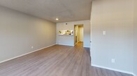 This contemporary townhome in Universal City, TX offers 980 square feet of well-designed living space across two floors. The ground floor (510 sq ft) showcases an open-concept layout, combining the kitchen and living areas. The kitchen features a modern design with two-tone cabinetry, stainless steel appliances, and a subway tile backsplash. The living room is highlighted by a stone-faced fireplace and large windows that invite natural light.

Upstairs, the 470 sq ft space includes two bedrooms, with the primary bedroom measuring 130 sq ft. All three bathrooms are equipped with modern fixtures and finishes. The property boasts updated flooring throughout, with luxury vinyl planks in the main living areas and plush carpeting in the bedrooms.

Additional amenities include a pantry for extra storage, two closets, and ceiling fans in the bedrooms and living room for improved air circulation. The neutral color palette and contemporary design elements create a fresh, inviting atmosphere throughout the home. With its efficient use of space and modern touches, this townhome offers comfortable urban living in a prime location.