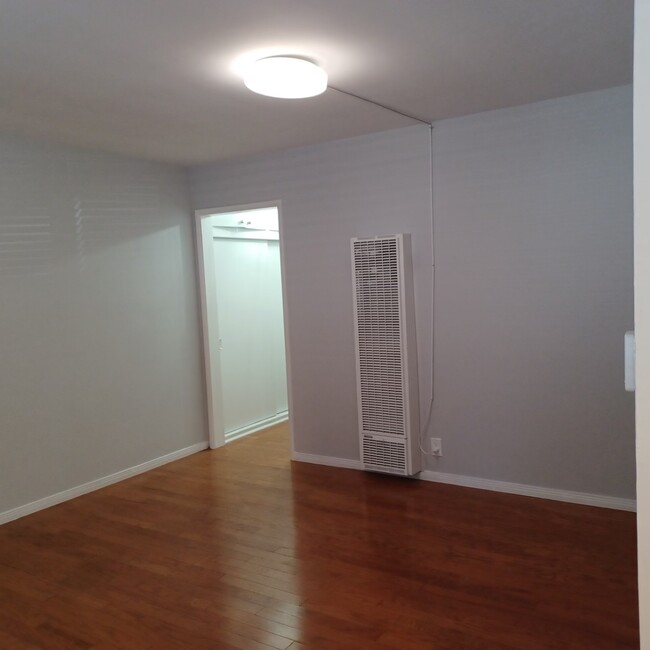 Living Room with New Wall Heater and Light - 930 E 1st St