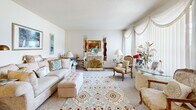 Located in Oakdale, Minnesota, this single-floor, 2-bedroom, 1-bathroom home offers a practical and comfortable layout. The open-concept living and dining area serves as the heart of the home, featuring carpet flooring, a textured ceiling, and a ceiling fan. A standout decorative stone fireplace with a classic fan-style screen anchors the living room, adding character and warmth to the space. Large windows with draped treatments allow natural light to fill the room while offering pleasant outdoor views. The kitchen is equipped with warm oak cabinetry, ample counter space, white appliances, and tile flooring, seamlessly connecting to the dining area. The two bedrooms are carpeted and well-proportioned, each with access to generous closet storage — with five closets total throughout the home. The primary bedroom features sheer window treatments that invite soft natural light. A shared full bathroom is accessible from the hallway, featuring tile flooring, a vanity, and a tub-shower combination. Additional utility space and dedicated storage areas round out the functional floor plan. With a neutral color palette and a well-organized layout, this home offers a welcoming and livable environment in a residential Oakdale neighborhood.