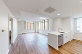 Located at 1855 St Francis St in Reston, VA, this single-floor residence offers 3 bedrooms and 3 bathrooms within a thoughtfully designed layout. The open-concept living, dining, and kitchen area serves as the heart of the home, bathed in natural light through large floor-to-ceiling windows. The kitchen is well-appointed with white shaker cabinetry, quartz countertops, a subway tile backsplash, stainless steel appliances including a gas range and dishwasher, and an island with a built-in sink. Hardwood-style flooring runs throughout the main living areas, adding warmth and continuity. The bedrooms offer comfortable retreats; secondary bedrooms feature plush carpeting and windows with outdoor views, while the spacious primary bedroom provides a generous footprint. Each of the three bathrooms is finished in a clean, modern style, with the full bathrooms featuring tiled tub-shower combinations, white vanities, and wood-look flooring. Additional conveniences include five closets, dedicated laundry, utility rooms, and a private patio. A connecting hallway ties the layout together efficiently, making the most of the well-proportioned floor plan.