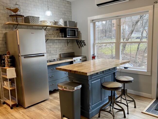 Modern new kitchen with marble wall - 124 Meacham St