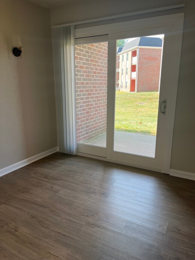 Dining room to Porch - Rose Hill Apartments