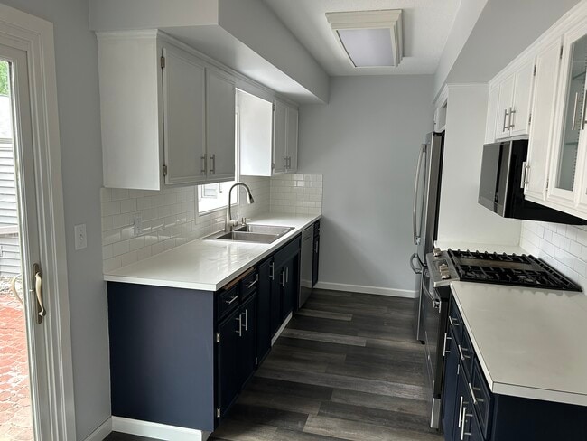 Kitchen with updated stainless fridge, gas range, dishwasher and garbage disposal - 2706 Mackubin St