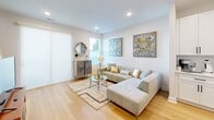 Located at 203 29th Ave NE in Hickory, NC, this two-story home offers a thoughtfully designed layout across two floors. The main level features light-toned hardwood flooring throughout, anchored by an open-concept kitchen and dining area. The kitchen is equipped with white shaker cabinetry, stainless steel appliances including a french door refrigerator and range, a subway tile backsplash, and a central island with seating — ideal for both everyday use and entertaining. Adjacent to the kitchen, the dining area provides a dedicated space for meals, while the living room offers a bright, airy atmosphere with recessed lighting and natural light from a large window. A full bathroom on this floor features white shaker vanity cabinetry, a large mirror, and a tub-shower combination. Upstairs, the spacious primary bedroom receives abundant natural light through multiple windows fitted with blinds and includes a ceiling fan. The second bedroom also features plush carpeting, a closet with built-in wire shelving, and a bright window. The primary bathroom offers a double-sink vanity with white cabinetry and a large mirror. A dedicated walk-in closet with wire shelving adds practical storage. Clean lines, neutral tones, and consistent modern finishes give the entire home a cohesive and welcoming character.
