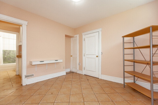Building Photo - Bright, Beatutiful & Look Out Basement Apt.