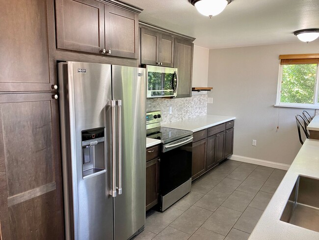 Building Photo - University Gem with Spacious Yard & Garage...