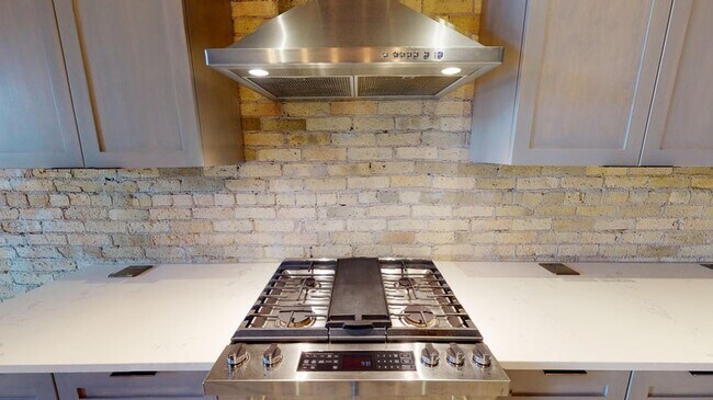 Jenn-Air 5 Burner Stove and Hood. Quartz countertops with pop-up outlets. - 334 Main St