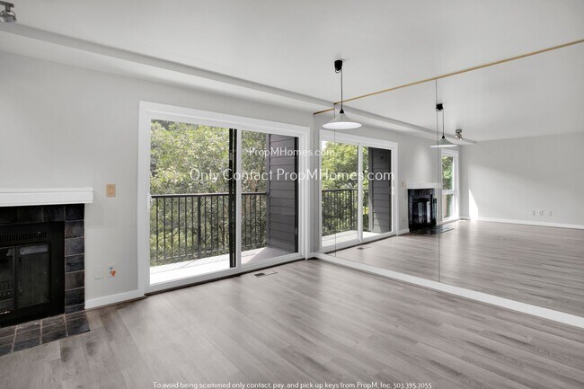 Building Photo - Charming Condo with Covered Parking and Tr...
