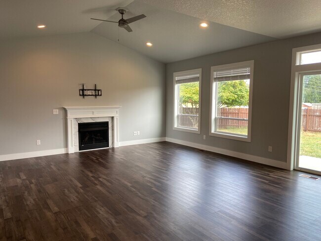 Large living room with patio slider to backyard - 1016 NW 56th Way