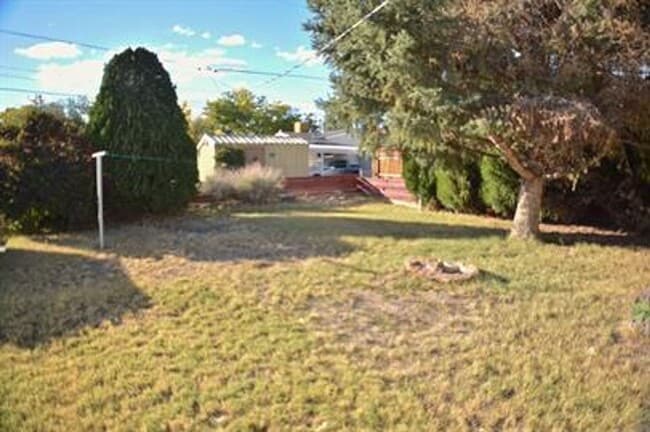Building Photo - Updated house with original hardwoods and 2-car garage!