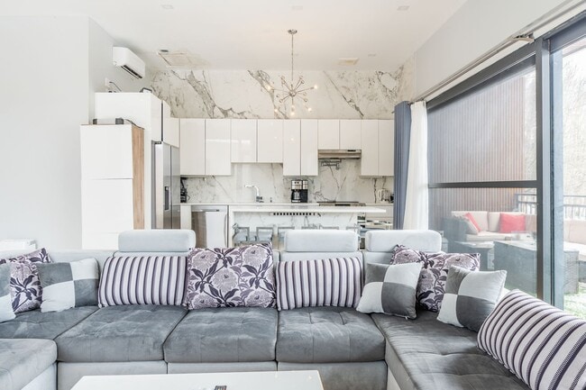 Building Photo - Modern Mountain Retreat with Rooftop Hot T...