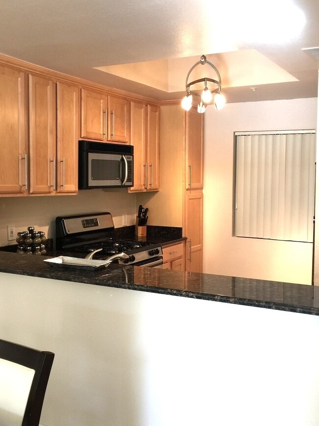 Building Photo - Long or short term available!  Live in lux...