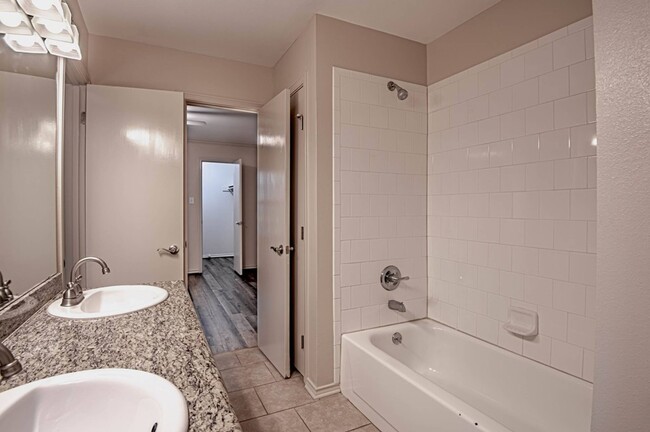 Bathroom with double vanity - Dogwood Village Apartments