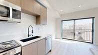 Located at 154 S Occidental Blvd in the heart of Los Angeles, this thoughtfully designed one-bedroom, one-bathroom unit offers a modern and efficient living space across a single floor. Light-toned luxury vinyl plank flooring flows throughout, lending a bright, cohesive aesthetic to the entire home.

The open-concept main area seamlessly connects the kitchen and living space, maximizing the sense of openness. The contemporary kitchen is outfitted with warm wood-grain cabinetry, clean white countertops, and a full suite of stainless steel appliances including a gas range, built-in microwave, dishwasher, and refrigerator. Recessed lighting and a large sliding window fill the space with natural light while providing views to the outside.

The bedroom is a cozy, well-proportioned retreat featuring light-filled windows with exterior views, light wood flooring, and warm white walls. Rich wood-toned interior doors with matte black hardware add a sophisticated, modern touch throughout the unit, including a double-door closet in the bedroom.

The bathroom is finished with crisp white herringbone-patterned tile in the walk-in shower, complemented by chrome fixtures, mosaic tile flooring, and clean, minimalist design. The unit also benefits from convenient in-unit systems and a functional, well-organized layout ideal for urban living in Los Angeles.