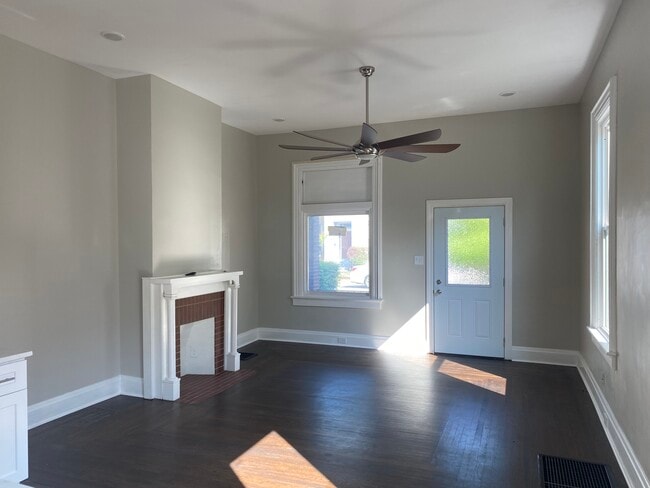 The living room, kitchen, and dining room are setup as a modern open concept living space - 308 Center St