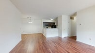 Located at 1063 Mosser Road in Breinigsville, PA, this single-floor, 2-bedroom, 2-bathroom home offers a well-designed layout with a comfortable and functional flow throughout. The open-concept living, dining, and kitchen area serves as the heart of the home, featuring rich hardwood-style flooring, crisp white walls, and abundant natural light. The living room is generously sized with a large sliding glass door that opens to the outdoors, as well as a charming bay window that further brightens the space. A pendant light fixture accents the dining area, adding a polished touch. The kitchen is equipped with dark espresso cabinetry, granite countertops, a peninsula with a built-in sink, and black appliances including a refrigerator, dishwasher, and microwave. A dedicated laundry room off the kitchen houses a full-size washer and dryer alongside a water heater. The spacious primary bedroom benefits from generous closet space with wire shelving systems, while four closets throughout the home provide ample storage. Both bathrooms are finished with tile flooring and full tub-shower combinations. The clean, neutral palette and consistent flooring create a cohesive, move-in-ready atmosphere throughout the entire home.