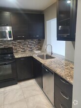 Building Photo - 7410 Woodmont Terrace