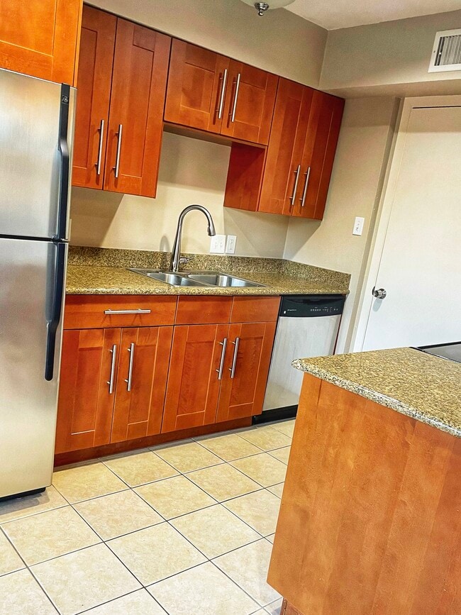 Kitchen with SS appliances - 10714 Pagewood Dr