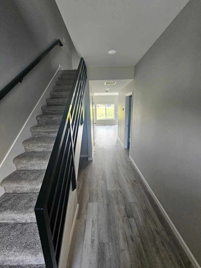 Entryway to 1st floor. With utility room and a half bath. - 1510 W 32nd St