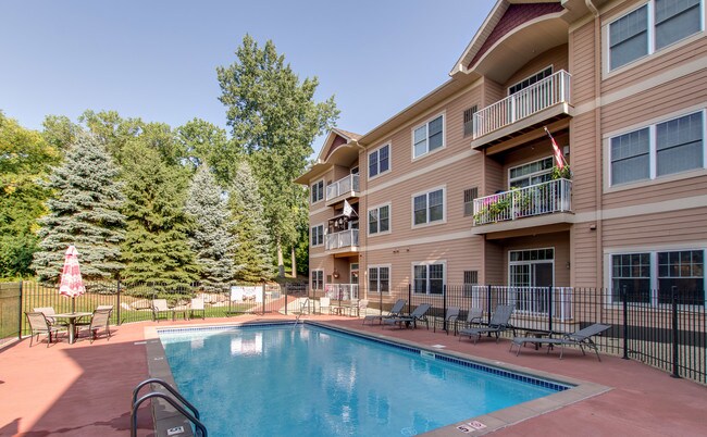 Mature trees surround the pool area - 14937 60th St N