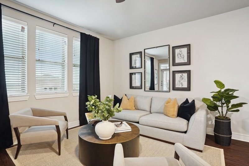 Living room with large windows and hardwood floor - Lakeview at the Gates of Prosper