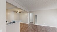 Located at 700 W La Jolla St in Placentia, CA, this 1-bedroom, 2-bathroom single-story unit offers a well-organized layout designed for comfortable everyday living. Wood-look flooring flows consistently throughout the entire space, lending a cohesive and modern feel.

The open-concept kitchen and living area form the heart of the home. The kitchen is equipped with white cabinetry, granite-style countertops, stainless steel appliances including a gas range and dishwasher, and a peninsula that provides additional prep space and a natural divide from the living area. A ceiling fan overhead and a wall-mounted A/C unit in the living room ensure year-round comfort. A sliding glass door fills the living room with natural light and provides outdoor access.

The bedroom is a comfortable, well-proportioned space featuring wood-look flooring, a textured ceiling, a window with vertical blinds, and a dedicated closet. The two bathrooms include a full bath with a tub/shower combo and a vanity bath featuring granite-style countertops, white cabinetry, and a mirrored medicine cabinet. A separate closet provides additional storage. Neutral warm-toned walls and textured ceilings carry throughout, creating a clean, move-in-ready atmosphere.