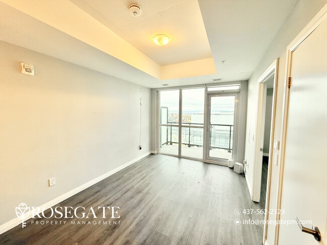 Photo du bâtiment - Modern 1-Bedroom Condo with Balcony in Dow...