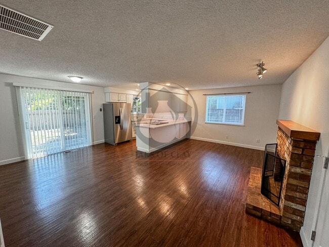 Building Photo - READY NOW! Charming Single-Level 3BD/2BA with Central AC, Wood Fireplace, and Landscaping Included!