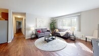Located at 120 Cambridge Ave in Waukesha, Wisconsin, this well-appointed two-bedroom, two-bathroom residence offers a comfortable and functional single-floor layout. Rich hardwood flooring flows throughout the home, lending warmth and continuity to every room.

The living area is generously sized, bathed in natural light from large windows dressed with vertical blinds that offer outdoor views of the surrounding greenery. The space transitions seamlessly into a dedicated dining area, complemented by a ceiling fan overhead.

The kitchen is efficiently designed with warm wood cabinetry, light stone-finish countertops, stainless steel appliances including a range and refrigerator, and a double-basin sink — providing ample prep and storage space.

The primary bedroom is notably spacious, featuring large windows with outdoor views and hardwood floors. It is served by a dedicated walk-in closet outfitted with wire shelving for organized storage. The second bedroom also benefits from natural light and a comfortable footprint. Both bathrooms include tub-shower combinations with clean, neutral finishes.

A hallway connects the rooms efficiently, and an additional closet provides further storage. The overall ambiance is bright, clean, and move-in ready, offering practical living in a straightforward, well-maintained layout.