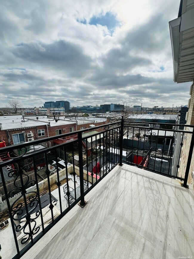 Building Photo - 25-63-63 125th St