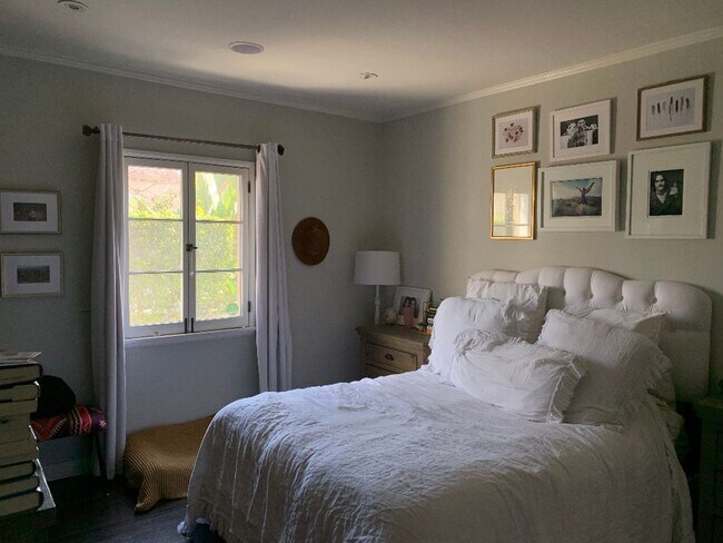 Bedroom with window looking out into front yard - 1045 S Hayworth Ave
