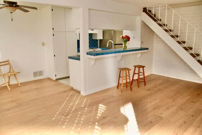 Kitchen and Breakfast bar, stairs to upstairs on right - 2468 Plata Ct