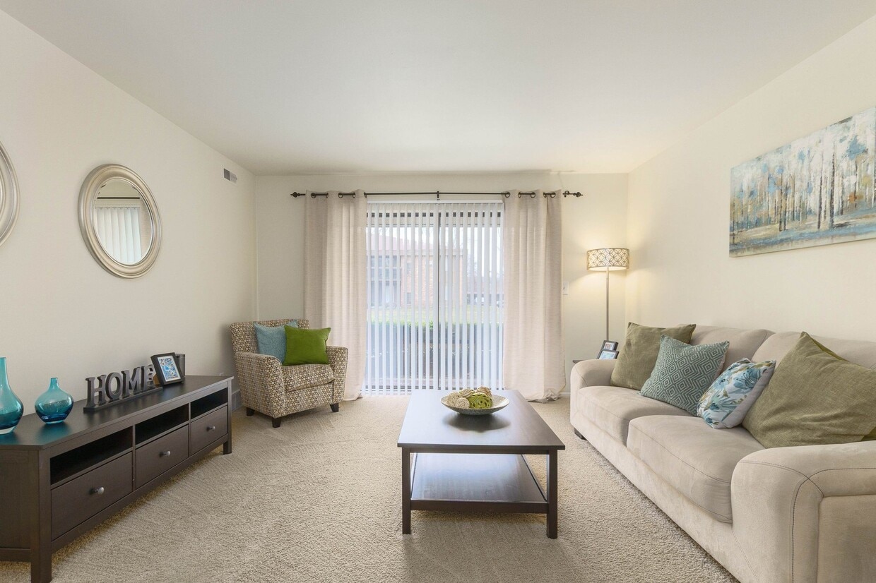 Bright and airy living room with natural light at Eastwood Village Apartments in Clinton Township, MI - Eastwood Village Apartments