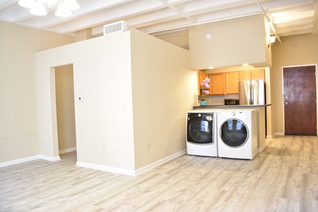 Left door to the closet and bathroom. Right door is the main entrance. Kitchen, and washer dryer - 32 Peachtree St NW