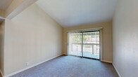 Located at 8079 Sunrise East Way in Citrus Heights, CA, this two-bedroom, two-bathroom unit offers a functional and comfortable single-floor layout. The living area features vaulted ceilings that enhance the sense of openness, soft carpeting underfoot, and a sliding glass door that opens to a private balcony with views of surrounding greenery, allowing natural light to fill the space.

The kitchen is well-appointed with white cabinetry, granite-look countertops, a double-basin sink, wood-look vinyl flooring, and black appliances including a range and refrigerator. A dedicated pantry closet adds convenient storage.

The primary bedroom is a comfortable size and includes a walk-in closet with built-in shelving and hanging rods. The second bedroom also features plush carpeting, a window with blinds for natural light, and a sliding-door closet with a hanging rod. Each bathroom is clean and functional — one features a wide vanity with granite-look countertops and ample cabinet storage, while the other includes a full soaking tub and shower combination. Wood-look flooring runs through the bathrooms, complementing the overall neutral color palette found throughout the unit. A hallway connects all rooms, contributing to an efficient and practical floor plan.